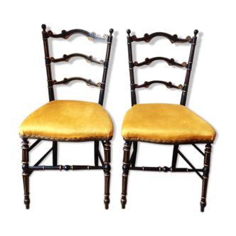 Pair of black and gold chairs