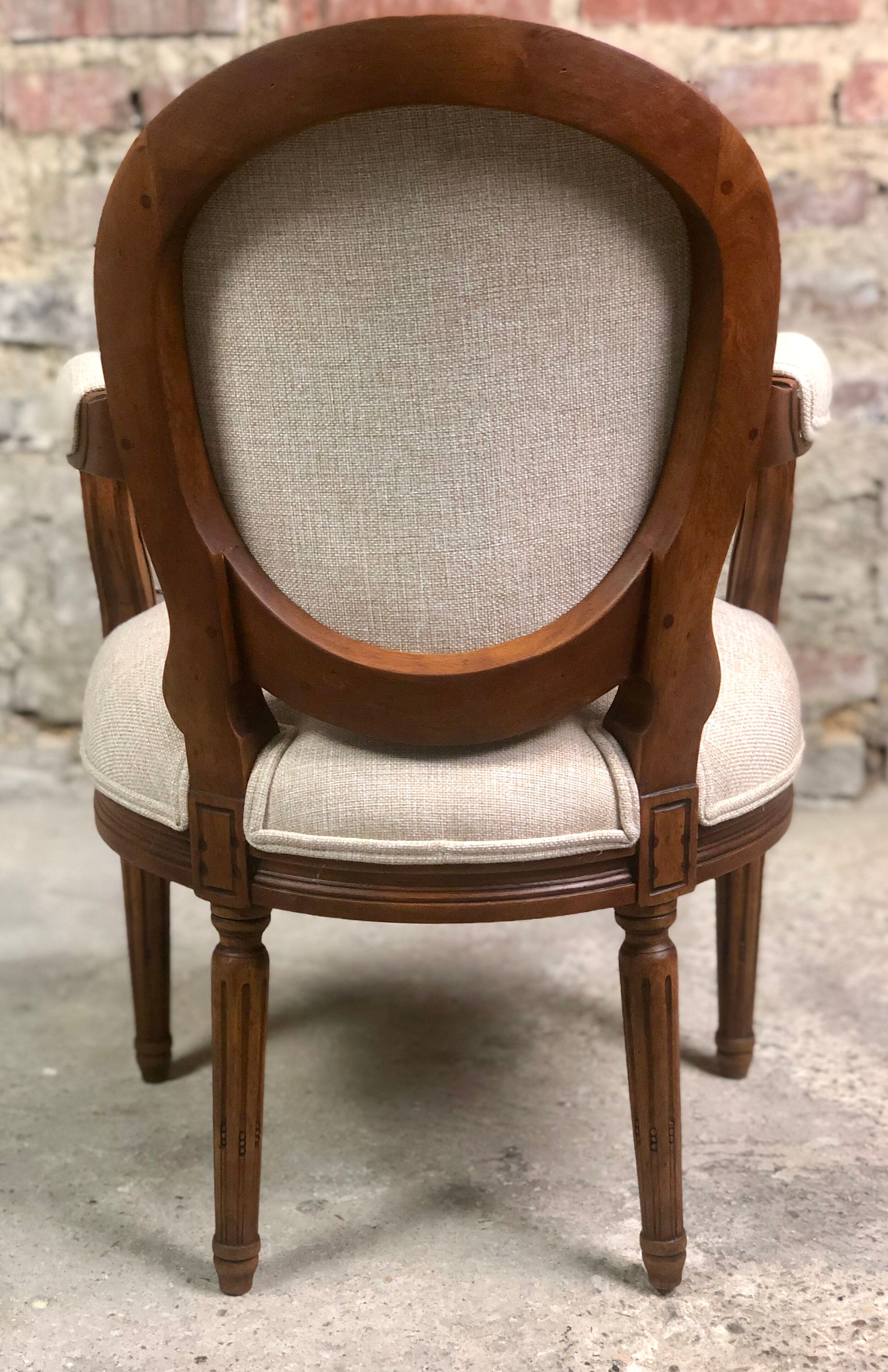 Louis XVI style children's armchair in carved walnut and beige antique upholstery