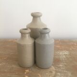 Three bottles of Mercure Bourdon Frères Paris sandstone