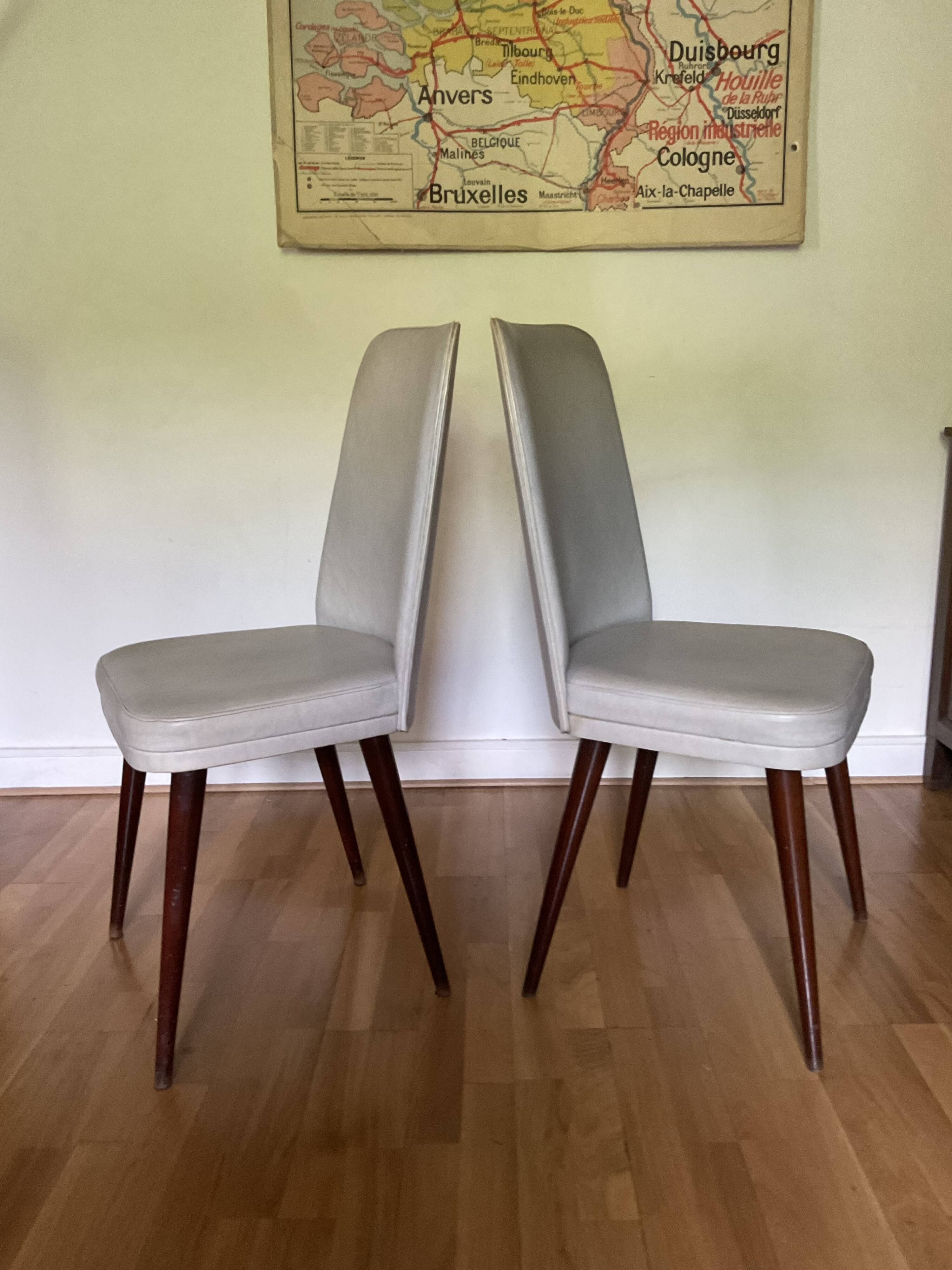 Pair of vintage mahogany and skai chairs