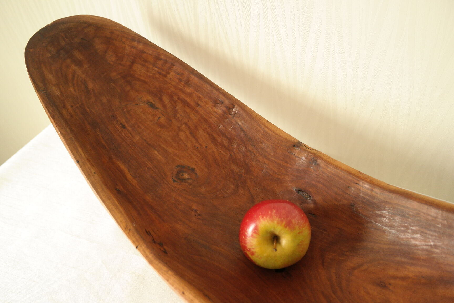 Brutalistic cut in exotic wood boomerang shape