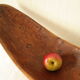 Brutalistic cut in exotic wood boomerang shape