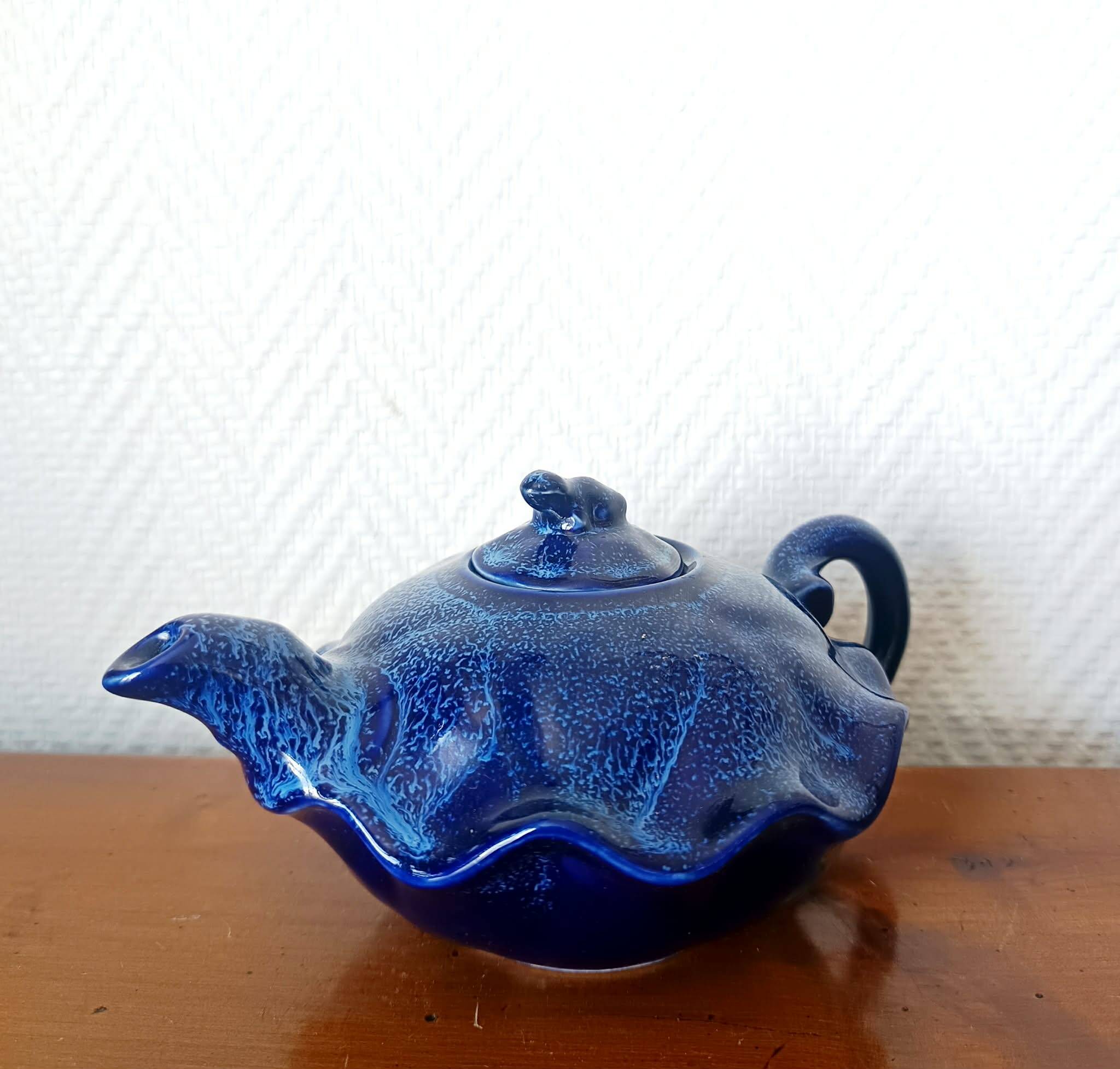 Blue ceramic Art Deco teapot with a frog.