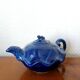 Blue ceramic Art Deco teapot with a frog.