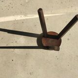 Small high tripod stool in brown solid wood