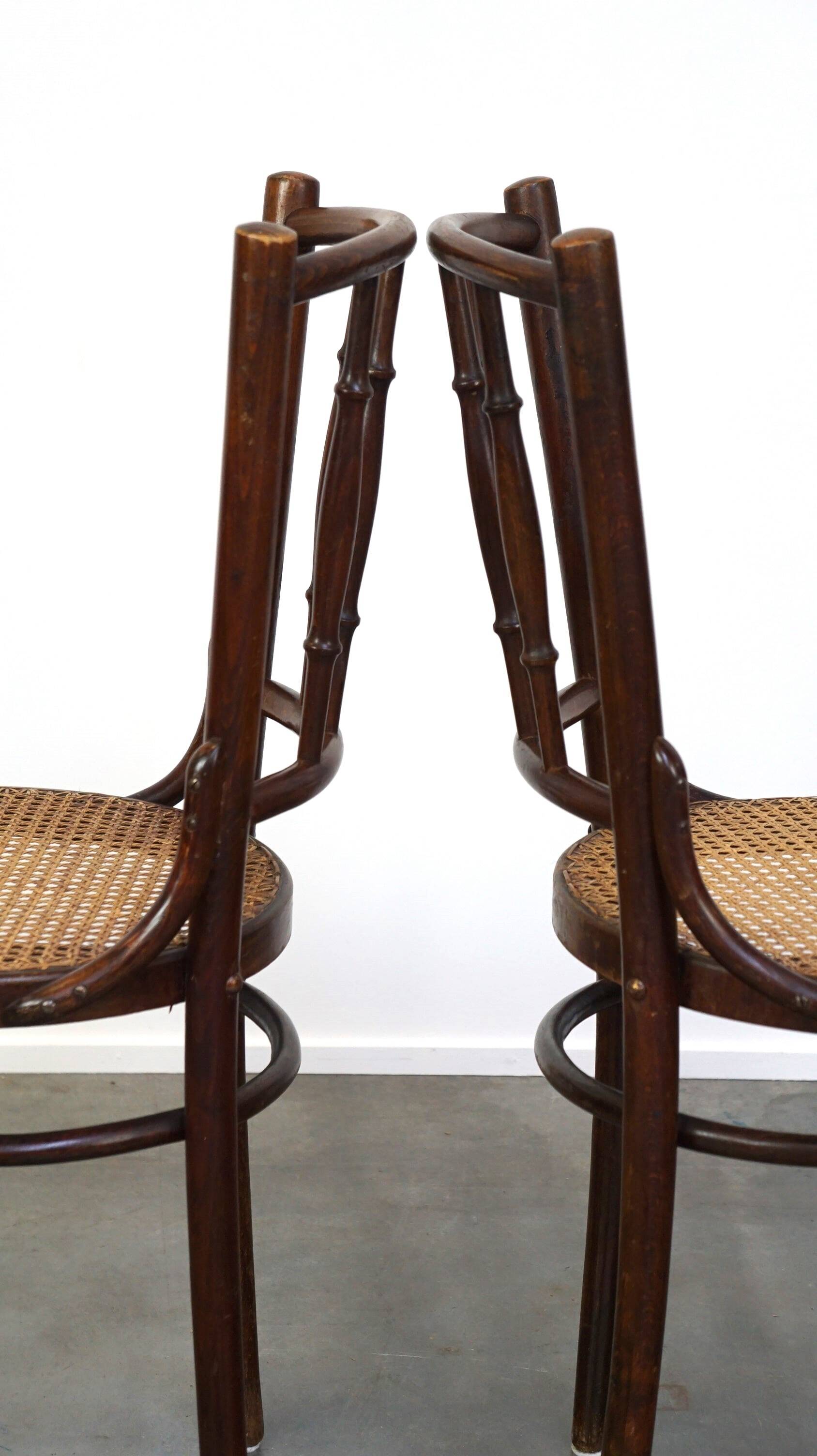 4 antique wooden and cane bistro chairs
