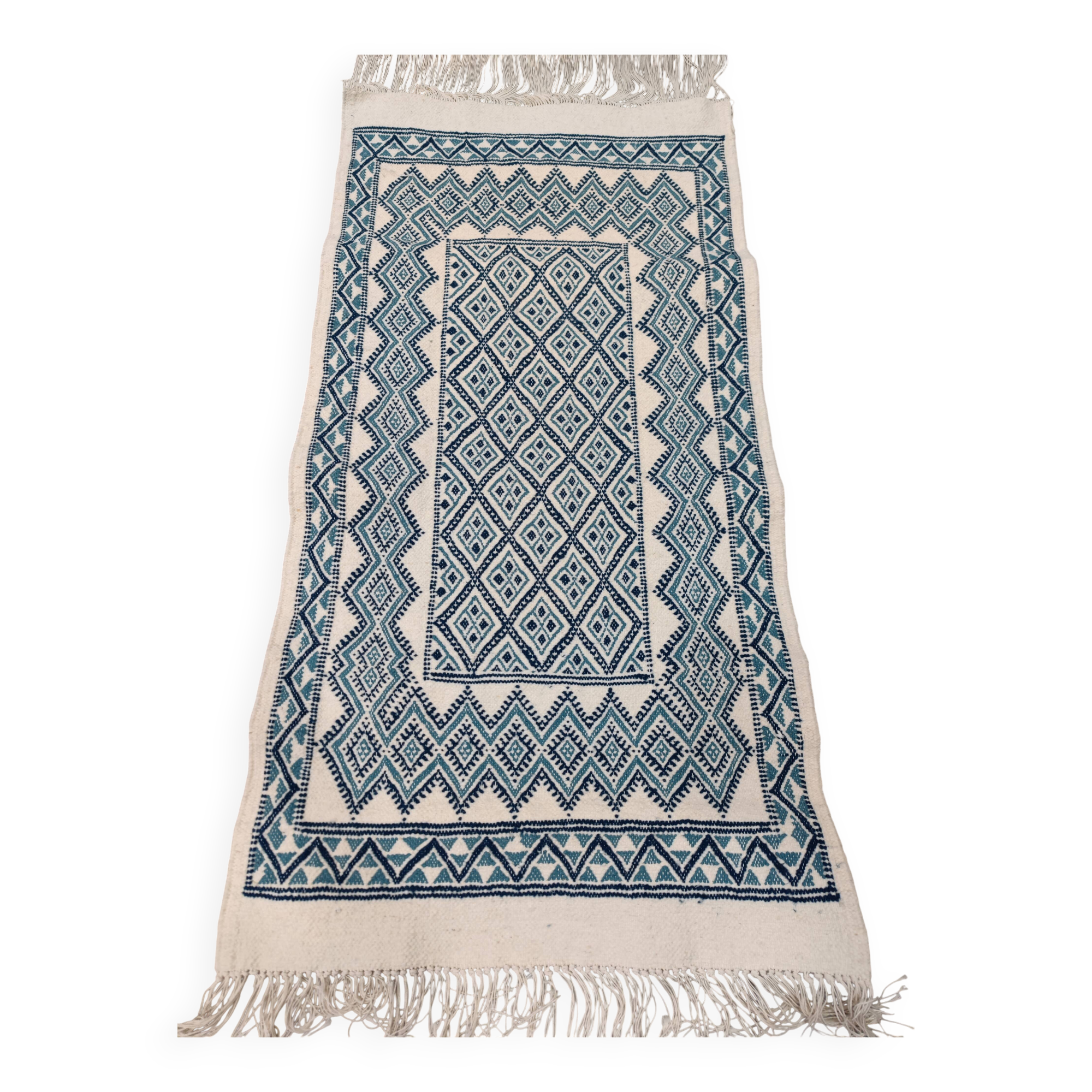 White and blue hand-woven rug in natural wool