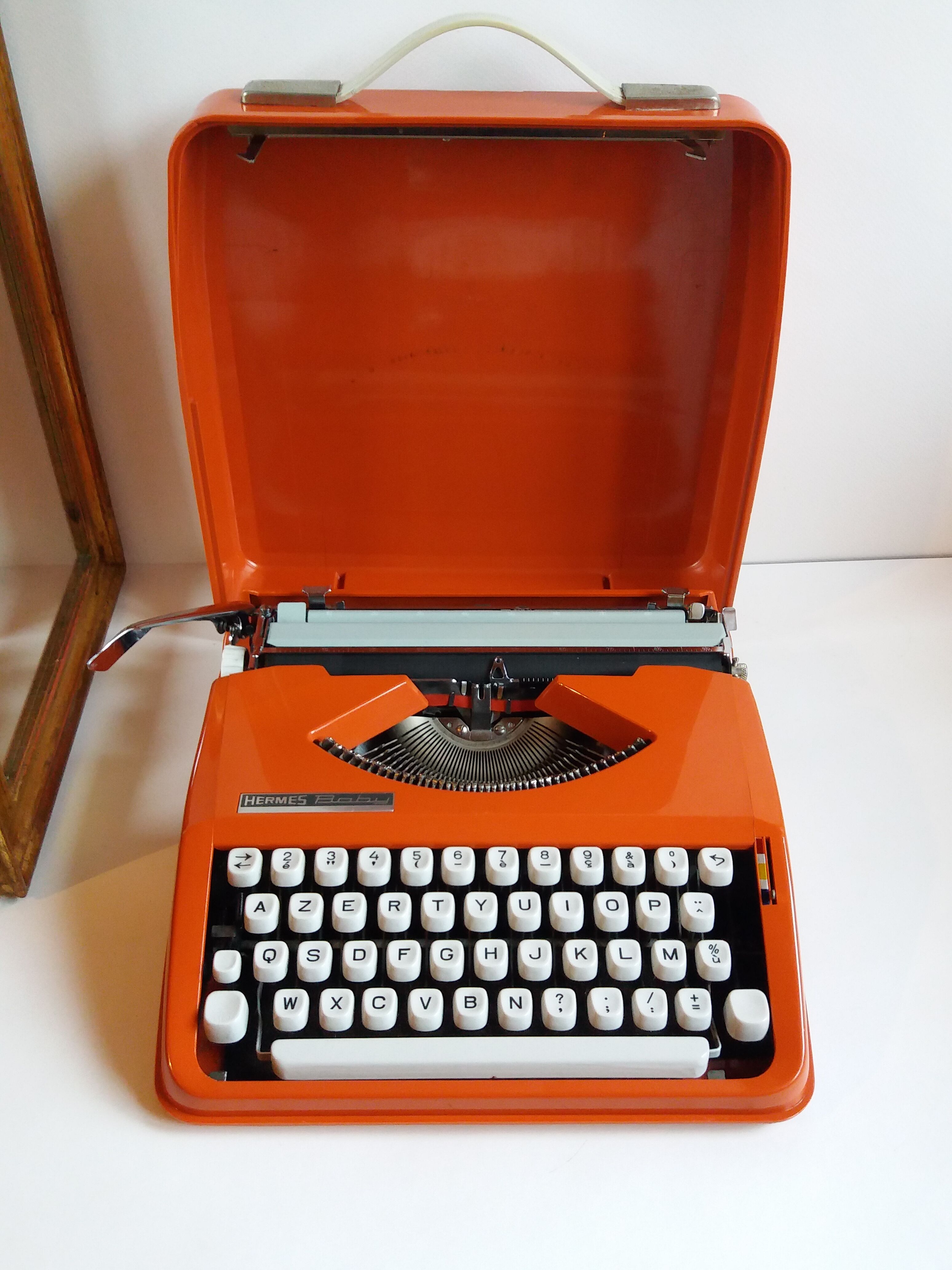 Hermes Baby orange typewriter
