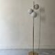 Cluster floor lamp with 3 spherical lamps in gold metal and white glass