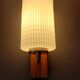 1960 wall light in gilded brass and rosewood.
