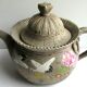 Japanese Art Deco teapot in porcelain biscuit enamelled with cranes and flowers