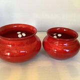Pair of red Scandinavian candle holders.