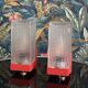 Pair of vintage wall lights in red plastic and clear glass