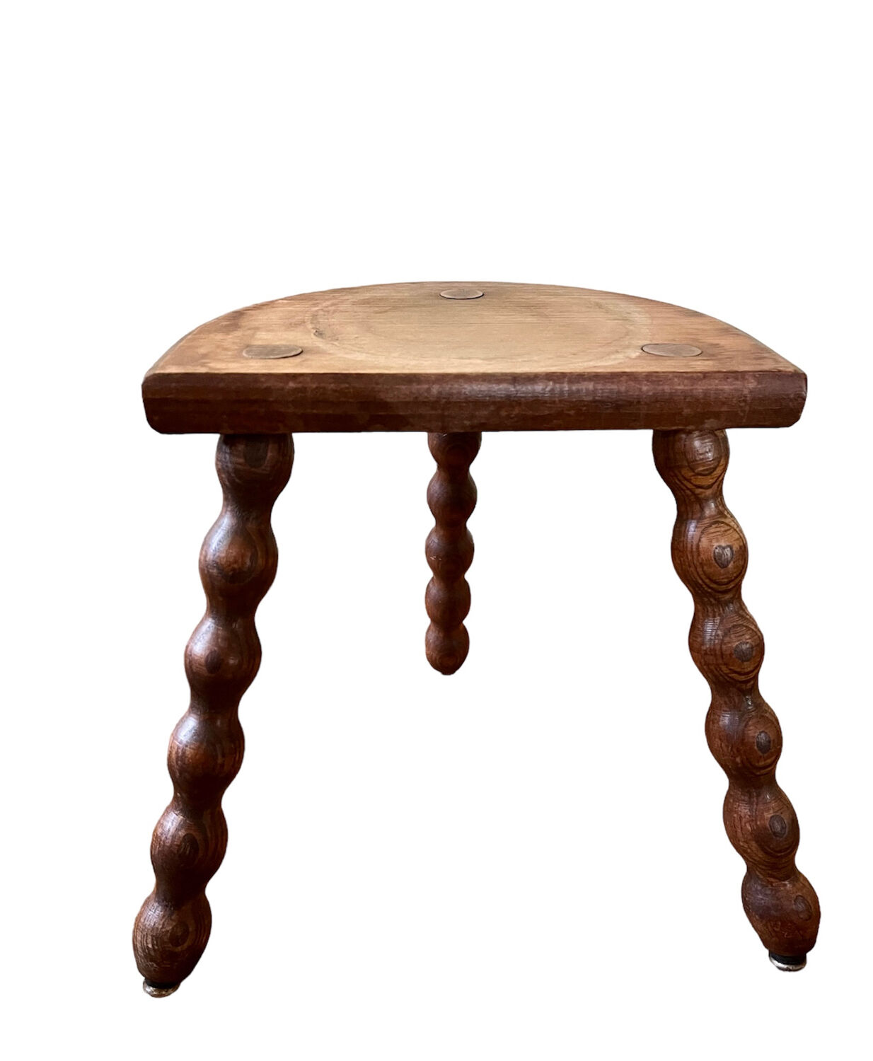 Low vintage wooden tripod stool
