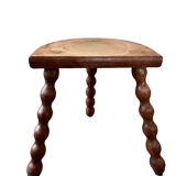 Low vintage wooden tripod stool