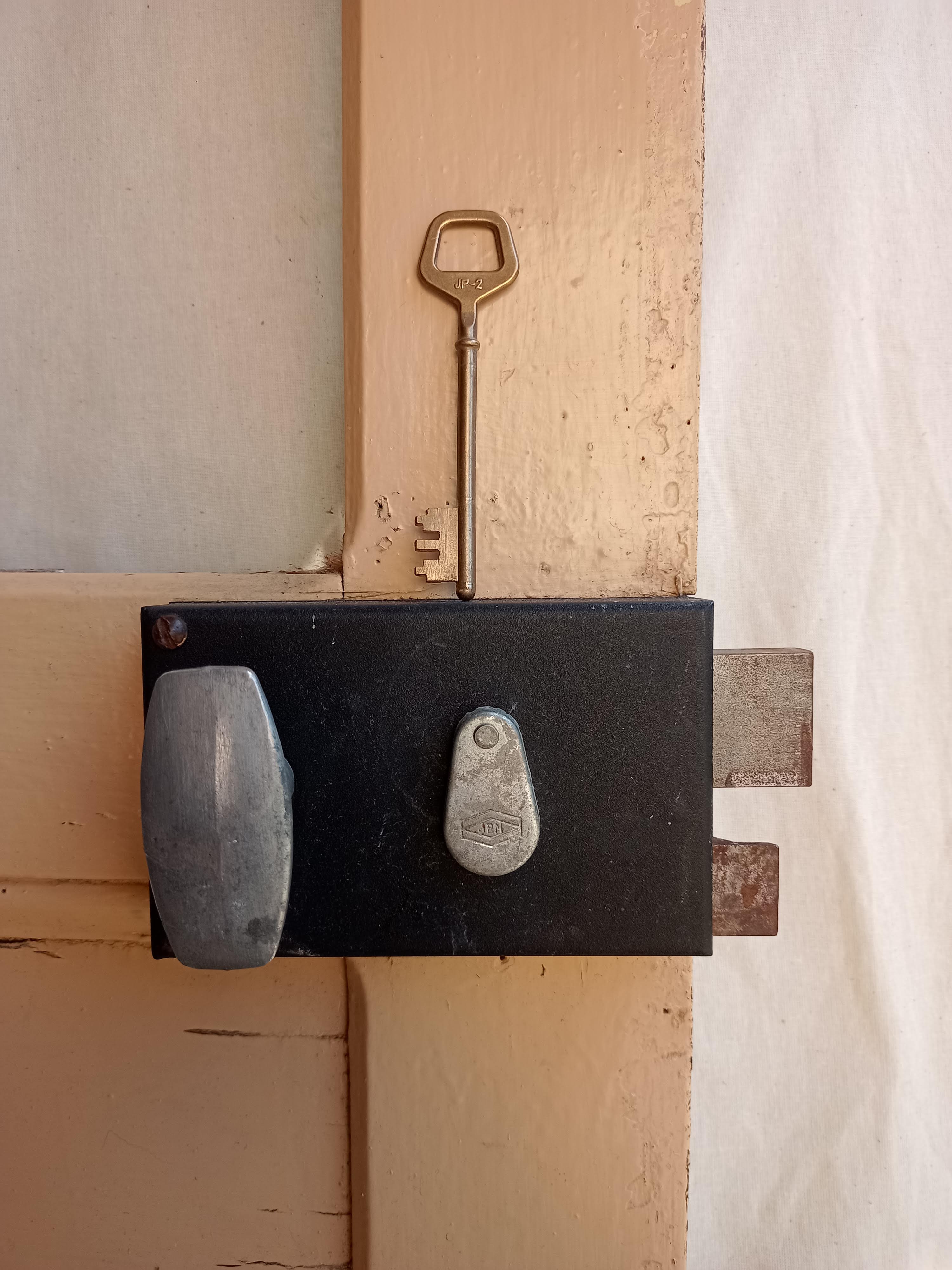 Old glazed door with its shutter