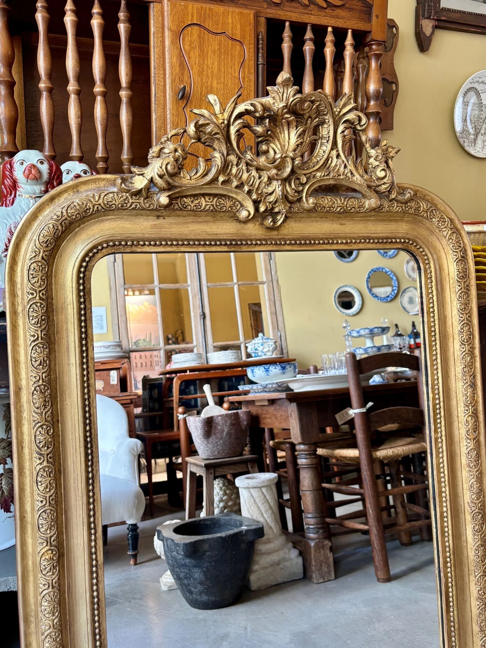 Gold sculpted and moulded stucco trumeau mirror 113 x 78 cm