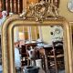 Gold sculpted and moulded stucco trumeau mirror 113 x 78 cm