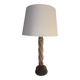 Wooden floor lamp with white tweed shade.