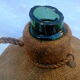 Demijohn dressed in burlap and padded cork