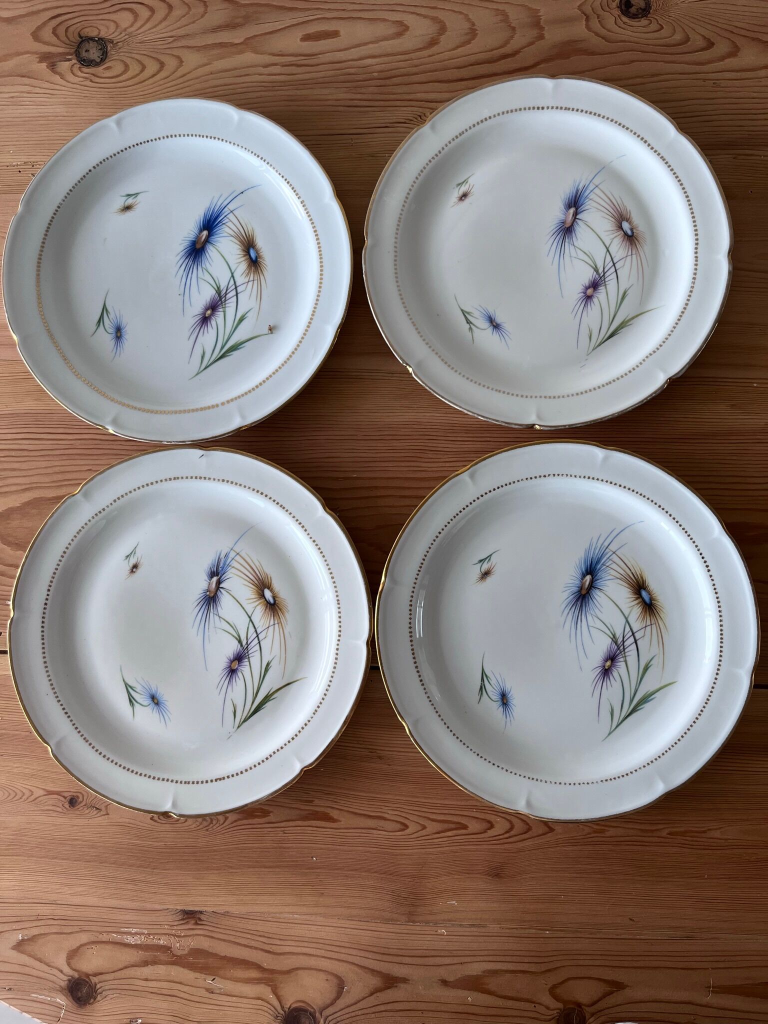 4 flat antique plates in Limoges porcelain