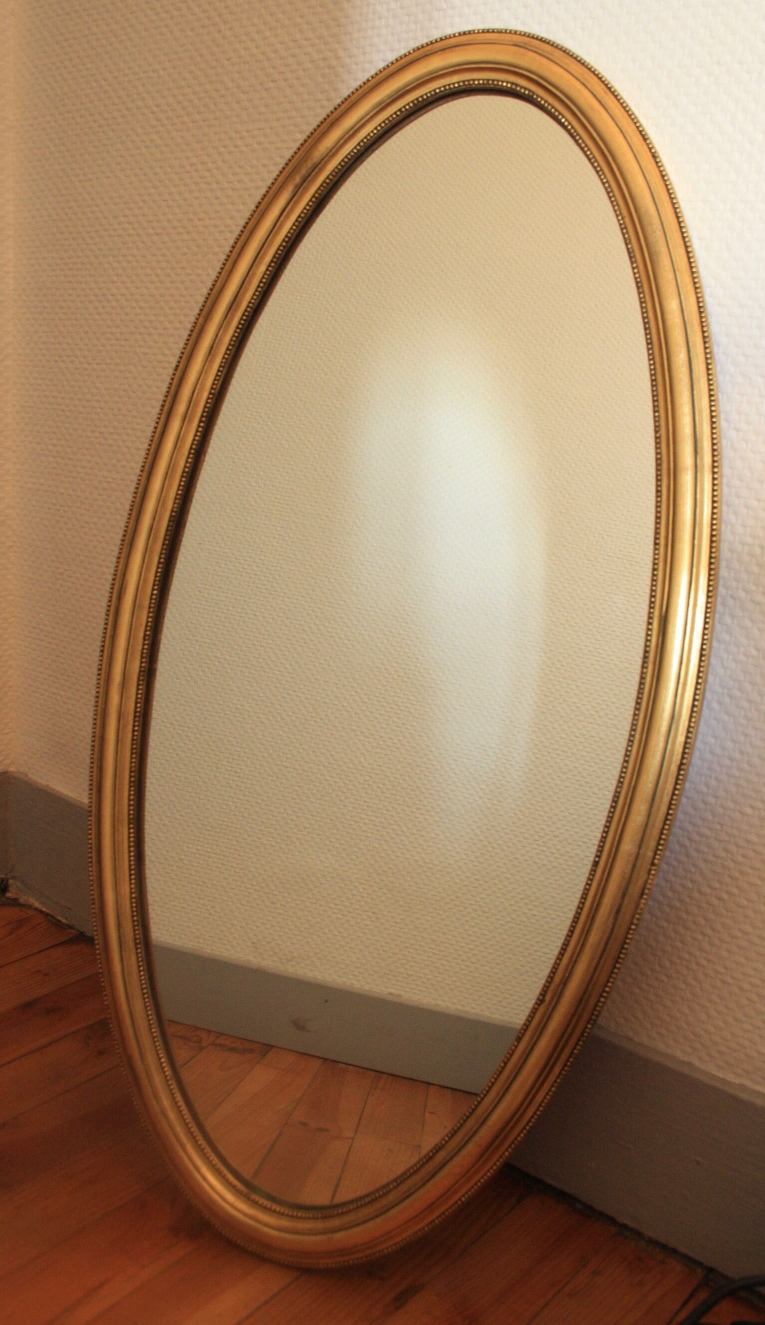 Miroir ovale en bois doré 80x42 cm