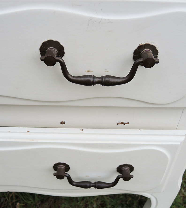 Old chest of drawers in white wood