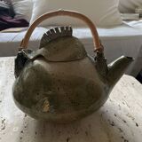 Handmade ceramic teapot with green fish and bamboo
