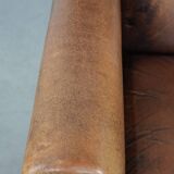 Large and comfortable sheepskin leather wingback chair with black piping