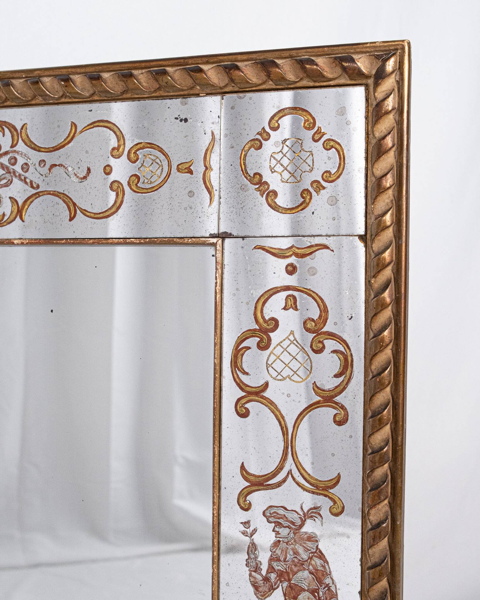 Miroir italien en verre églomisé, à parecloses, début XXe siècle