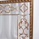 Miroir italien en verre églomisé, à parecloses, début XXe siècle