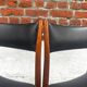 Set of 2 vintage Scandinavian chairs in wood and black faux leather.