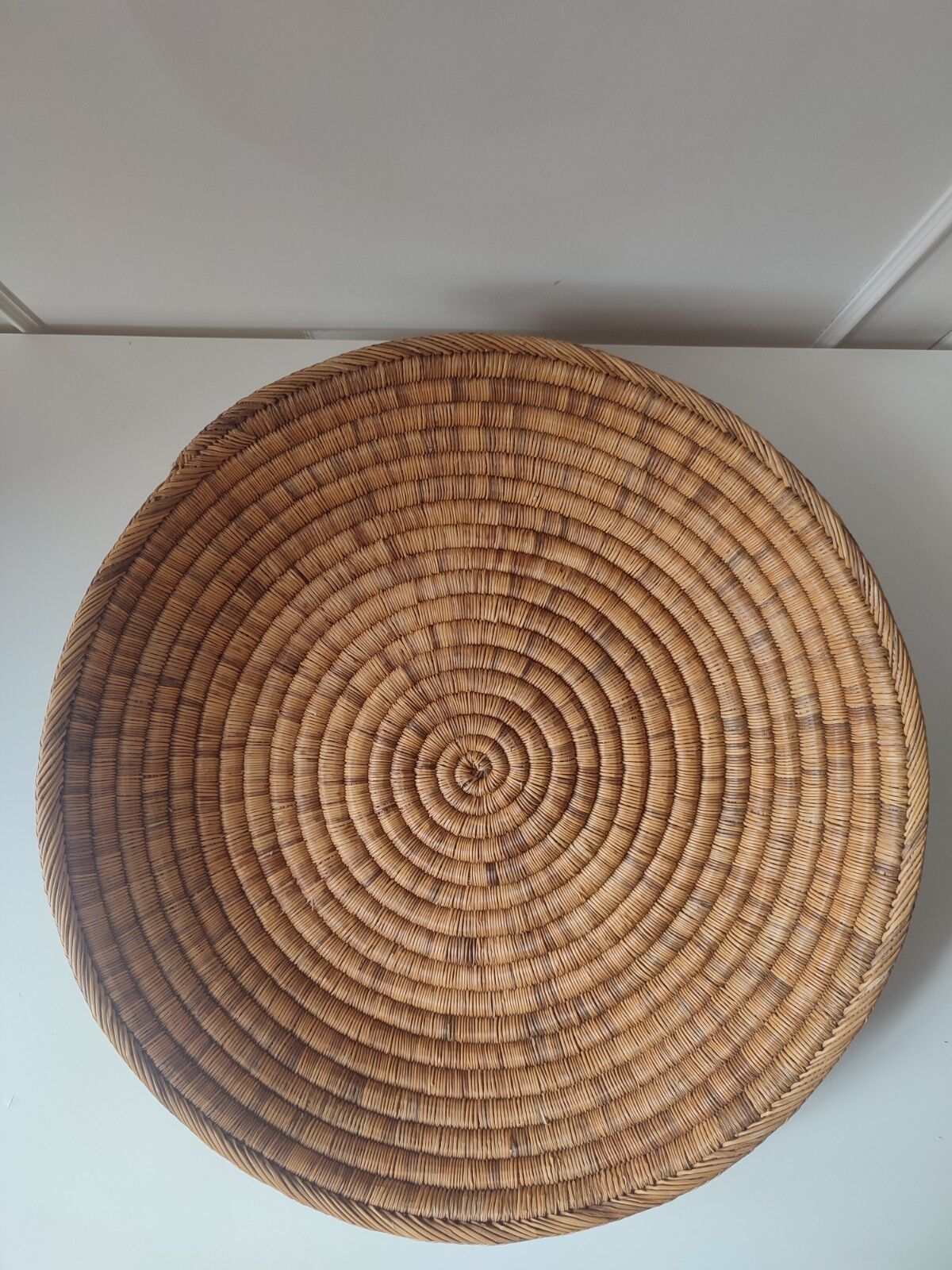 Ethnic plateau in woven palm leaf
