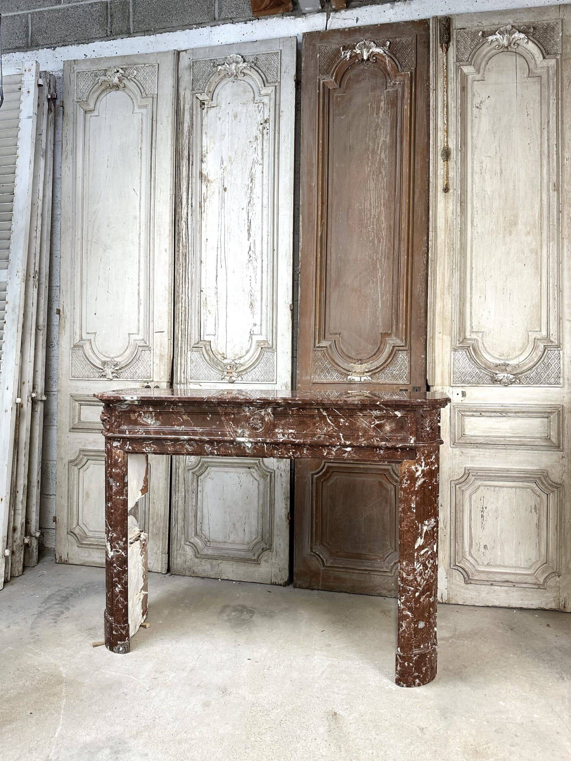 Red marble fireplace in the Louis XVI style, late 19th century