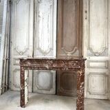 Red marble fireplace in the Louis XVI style, late 19th century