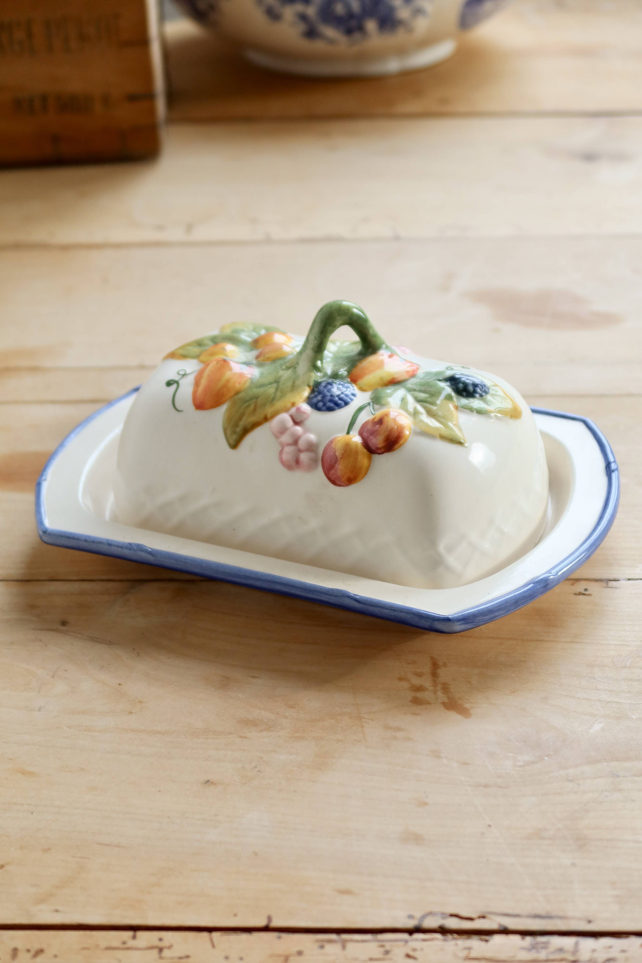 Large vintage faience butter dish with slip decoration – Fruit design