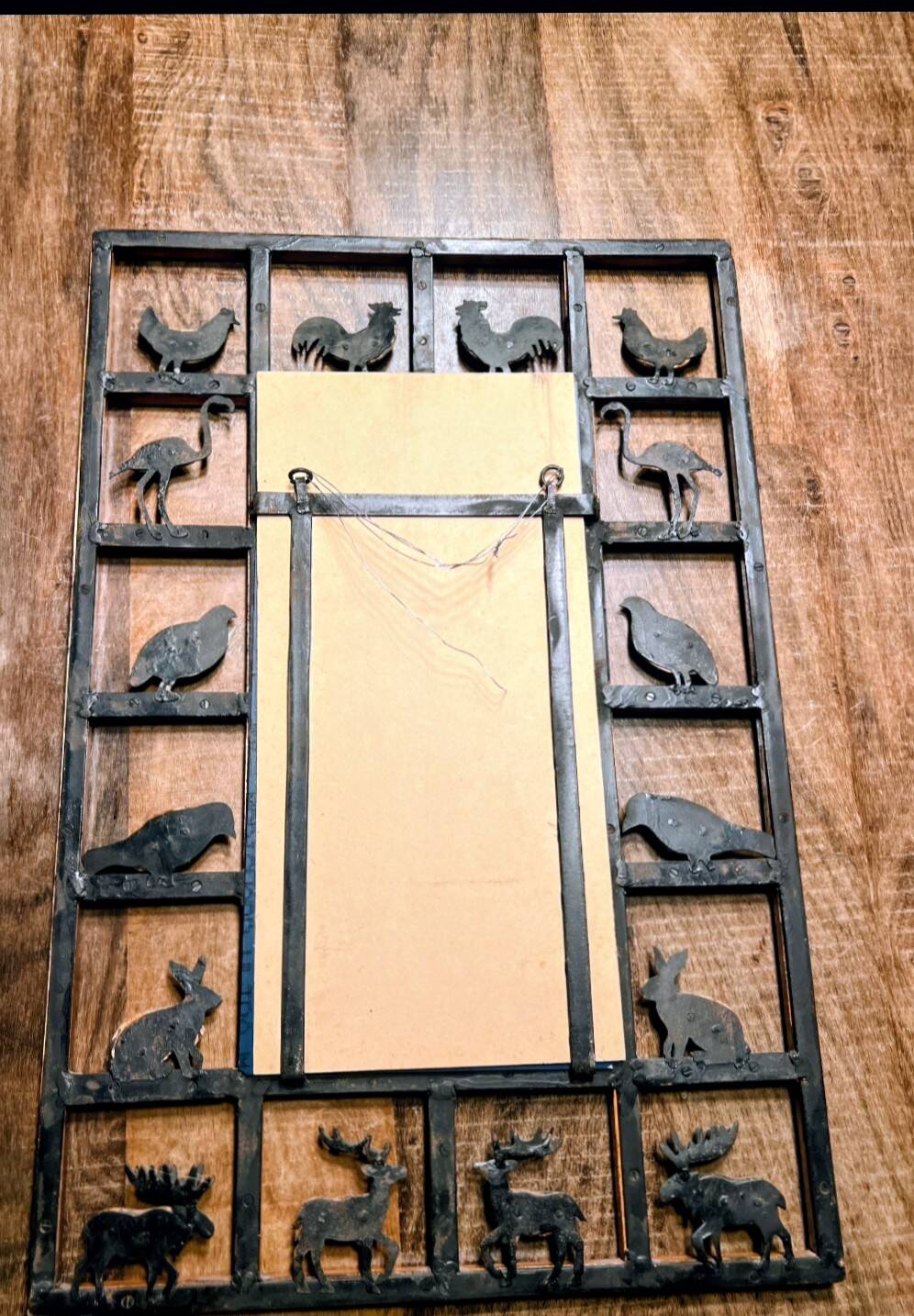 Wrought iron wood animal mirror