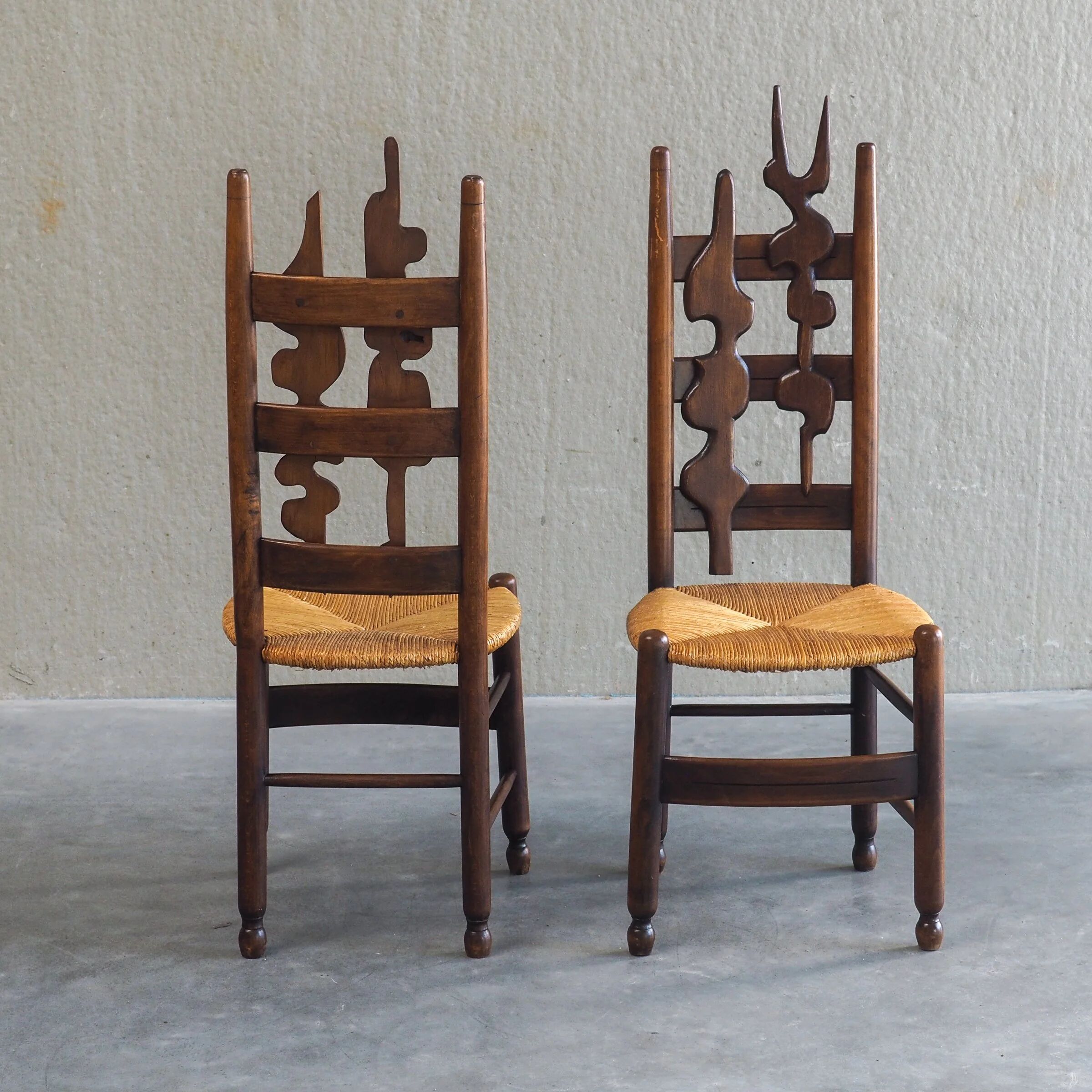 2 sculptural brutalist high-back chairs