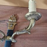 Pair of Empire style wall sconces in gilded bronze and green lacquer.