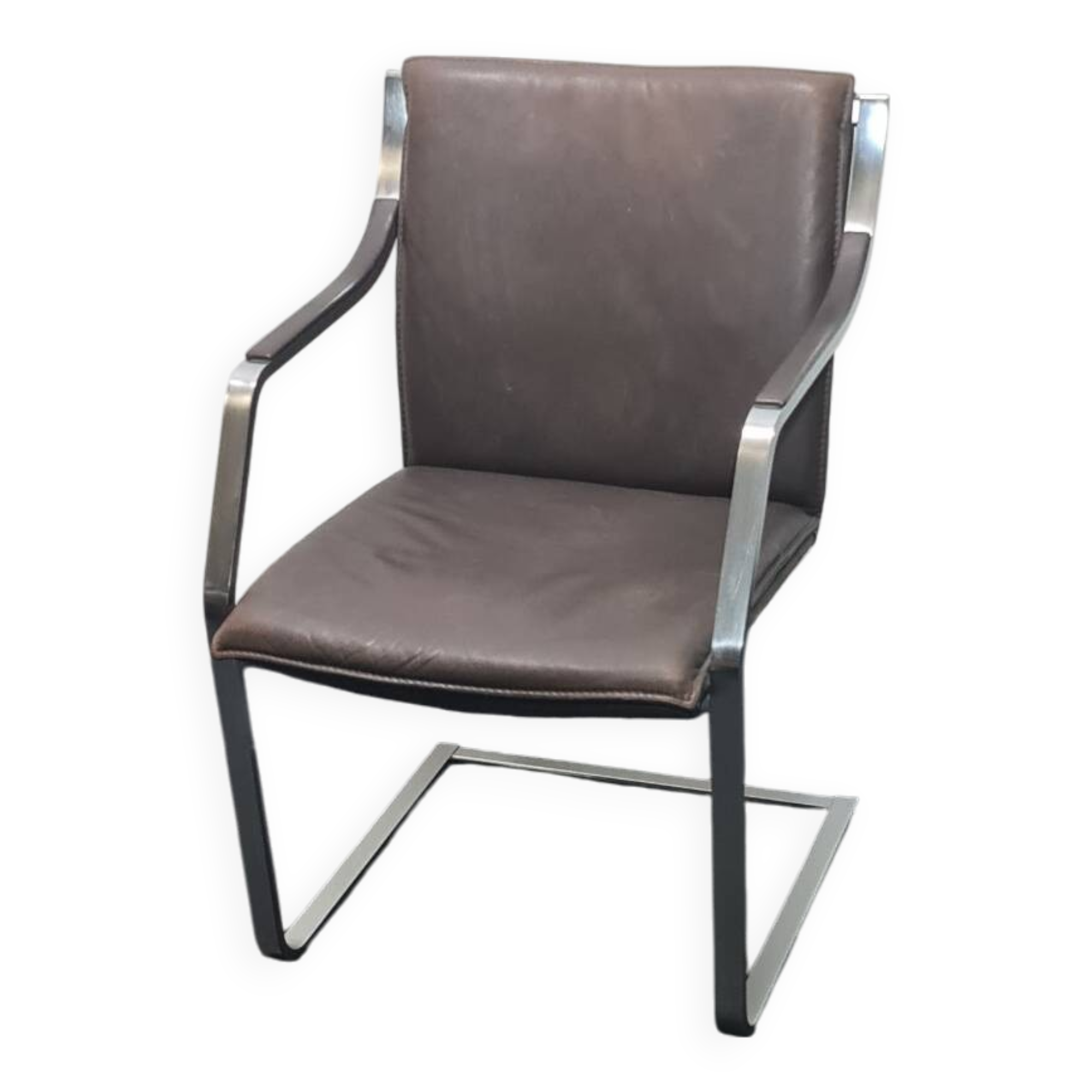 One of two vintage Leather and metal arm chairs.