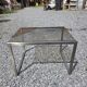 Table basse en métal brossé dessus verre fumé, années 70/80