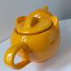 Orange-yellow elephant teapot