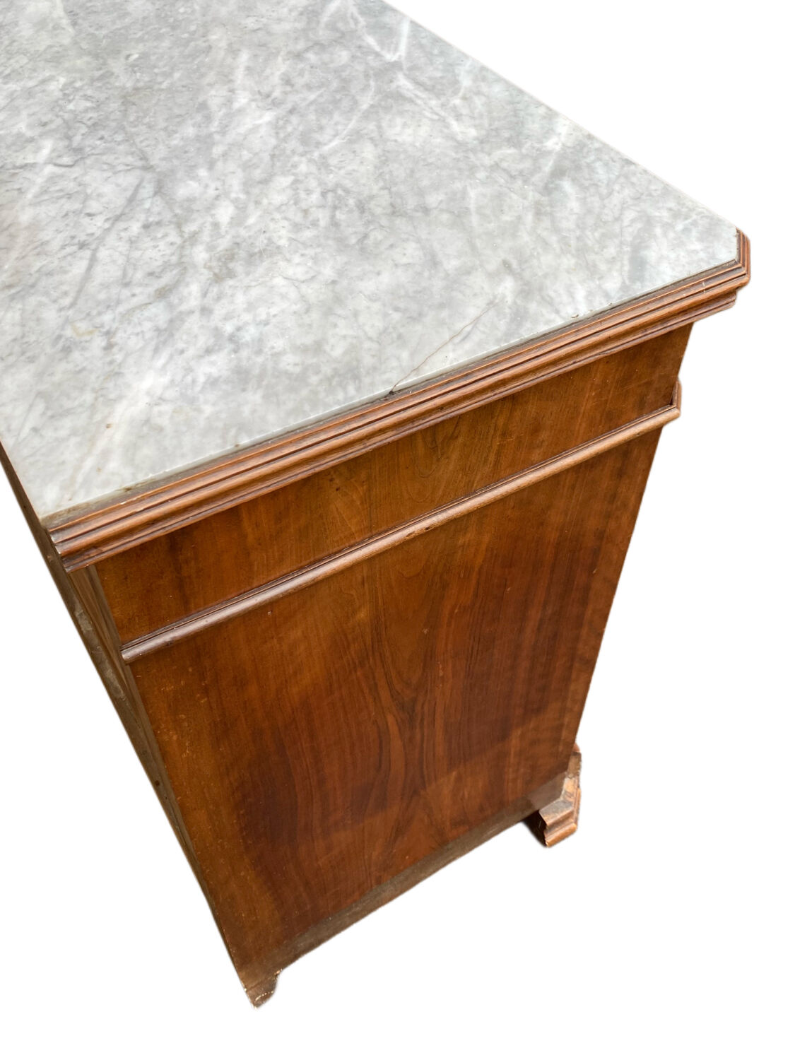 Antique Louis Philippe style chest of drawers with a white marble top.