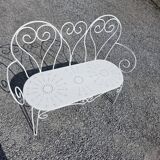Old garden bench in solid wrought iron