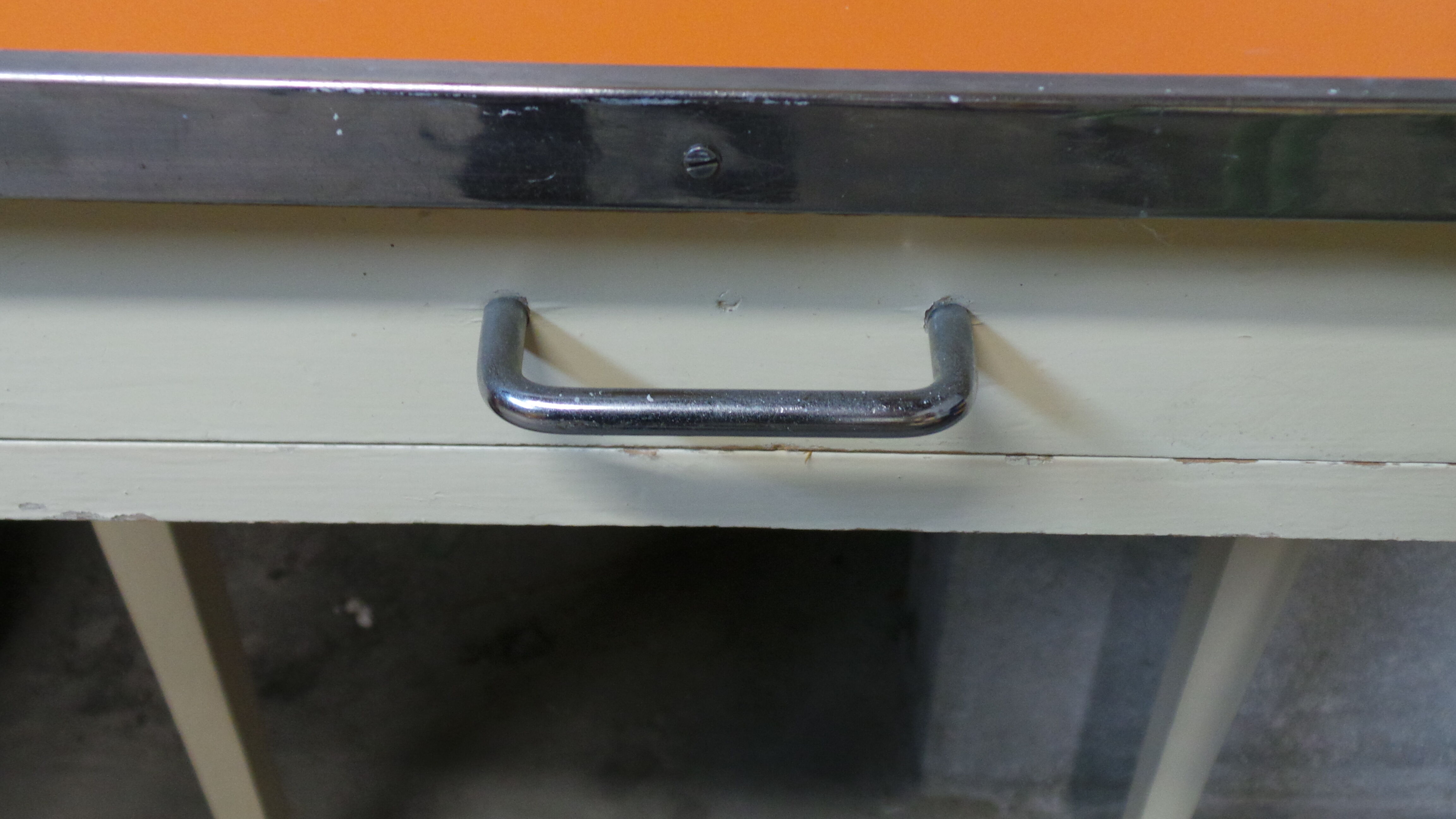 Orange wood and formica table