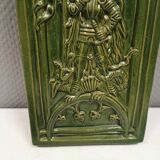 Antique tile in green faience, motif of Saint George and the dragon