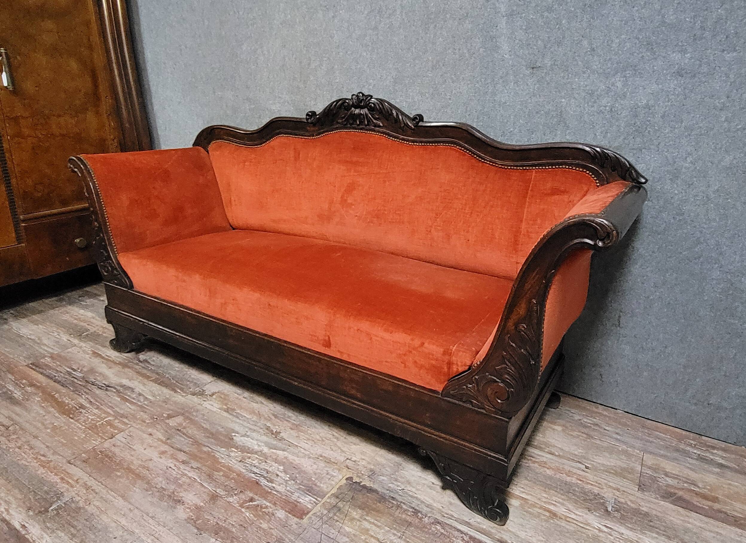 Sleeper or bench from the Charles X period in richly carved mahogany.