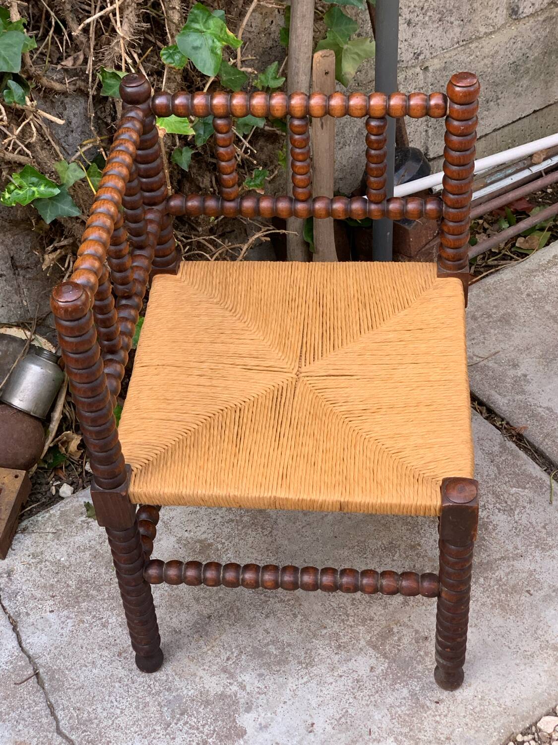 1920s turned wood straw corner chair