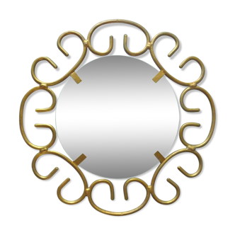 Round mirror with scrolls in gold metal from the 70s