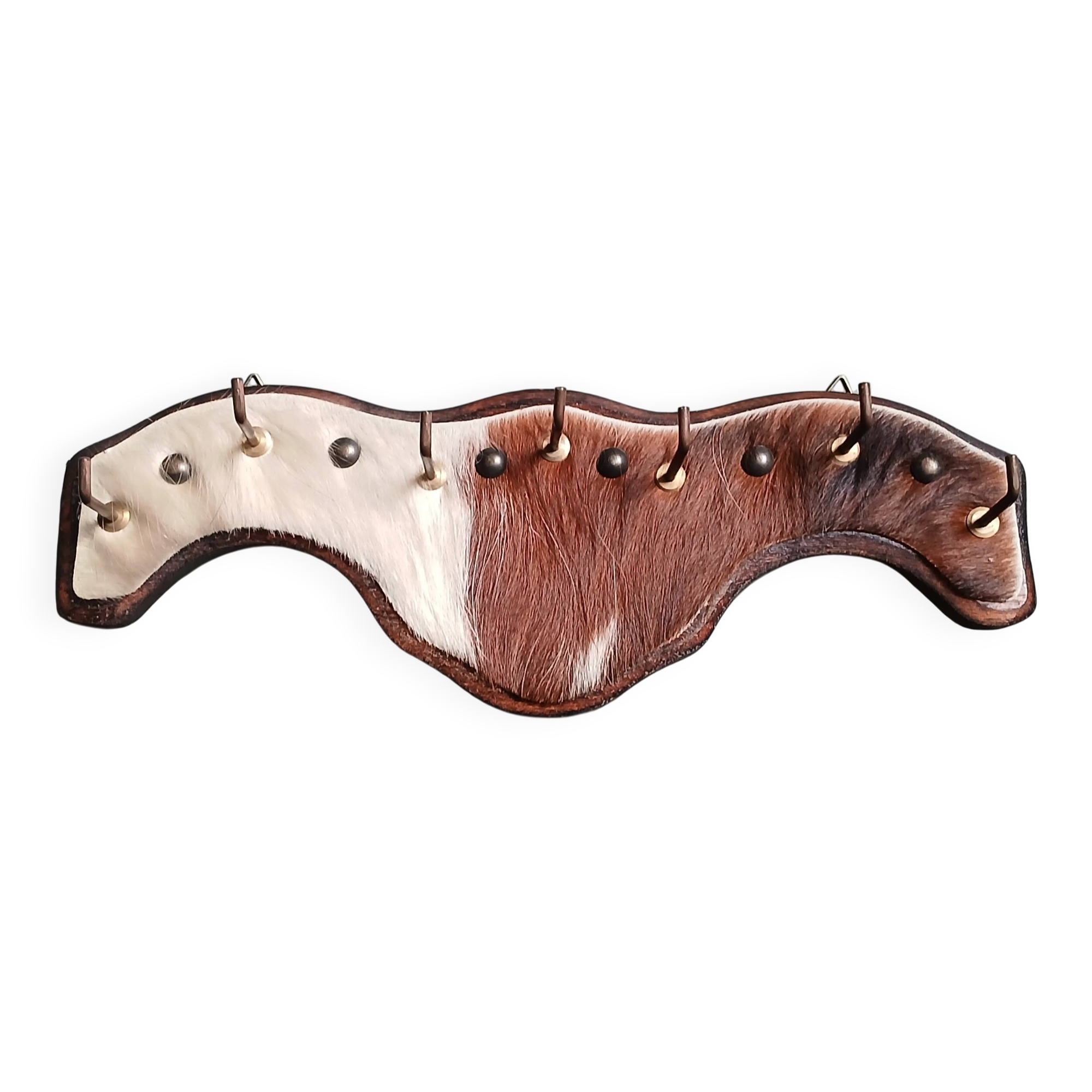Wooden coat rack, nails & cowhide
